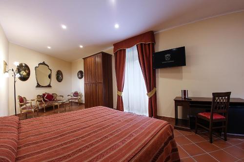 Säng eller sängar i ett rum på Grand Hotel Capodimonte