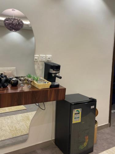a kitchen with a counter with a coffee machine at غرفه وصاله in Tabuk