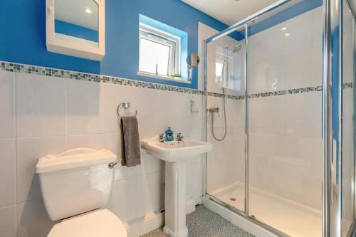 a bathroom with a toilet sink and a shower at 1 Bed in Hope Valley oc-pk849 in Bradwell