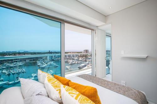 a bedroom with a view of the marina at Nautico nautico 8a in Puerto Vallarta