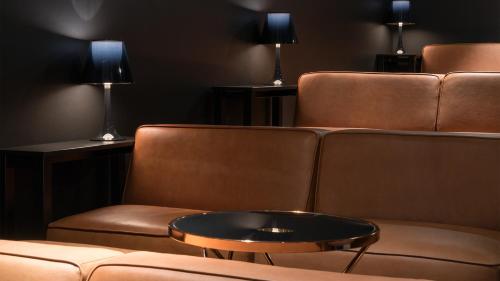 a living room with a couch and a table at Ruby Marie Hotel Vienna by IHG in Vienna