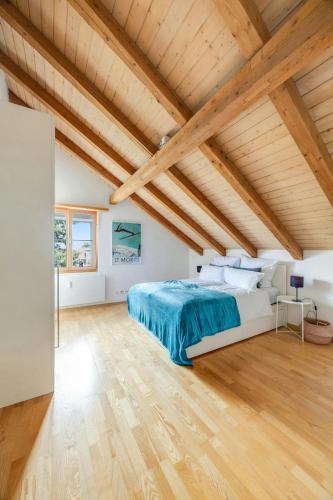 a bedroom with a bed and a wooden ceiling at Apartment in Sankt Moritz in St. Moritz