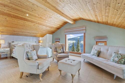a living room with a couch and two chairs at Apartment in Sankt Moritz in St. Moritz