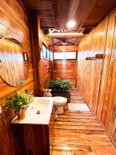 a bathroom with a toilet and a sink at Eco hotel oasis del mar in Cartagena de Indias