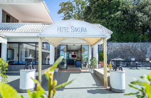 a hotel saarbar entrance with tables and chairs at Hotel Sakura, Sure Hotel Collection by Best Western in Torre del Greco