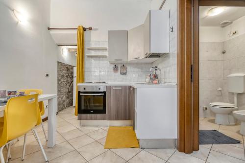a kitchen with a sink and a stove top oven at Alessia House in Ferrara