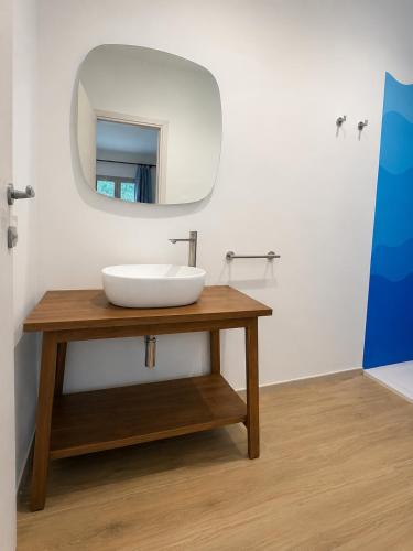 a bathroom with a sink and a mirror at Minnanni in San Pantaleo