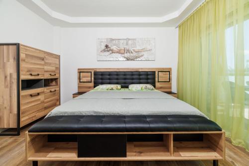 a bedroom with a bed and a large window at Apartments Maja in Selce