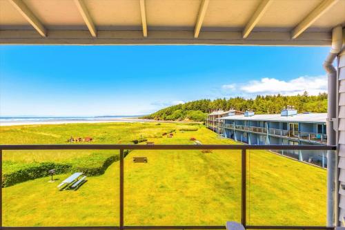 a view of the beach from the balcony of a building at Hi-Tide Resort Queen Bed Unit 29 in Moclips