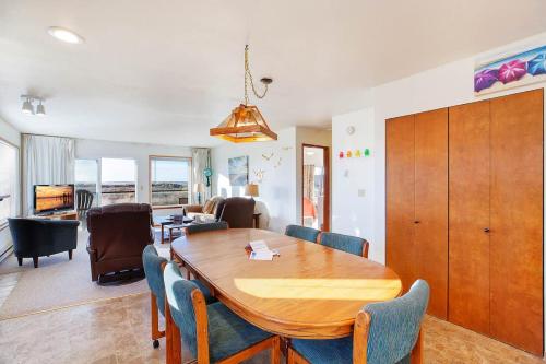 a dining room and living room with a table and chairs at Hi-Tide Resort Queen Bed Unit 12 in Moclips
