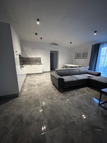 a large living room with a couch and a table at Villa Maria II in Vodice