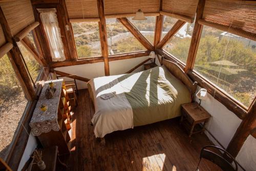 an overhead view of a bedroom in a tree house at Cabaña El Cóndor in Potrerillos