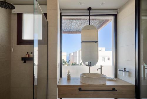 a bathroom with a sink and a mirror at Ananda Mojácar - Only Adults in Mojácar