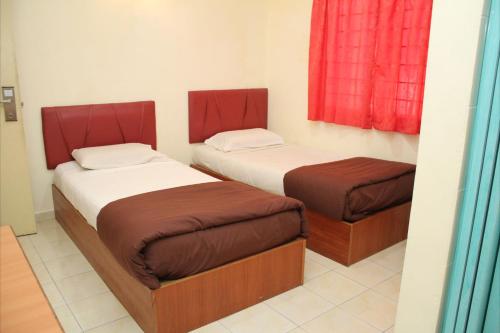 Кровать или кровати в номере Sea Front Hotel Port Dickson