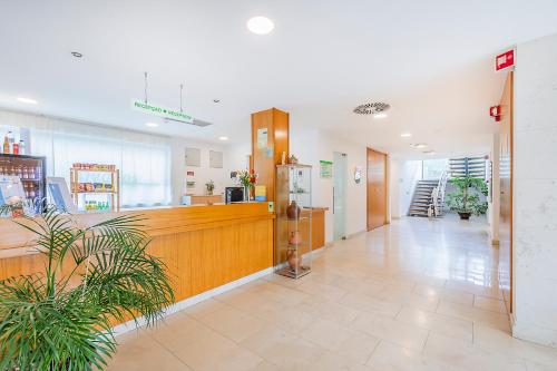 a lobby of a store with a cash register and a counter at HI Alvados - Pousada de Juventude in Alvados