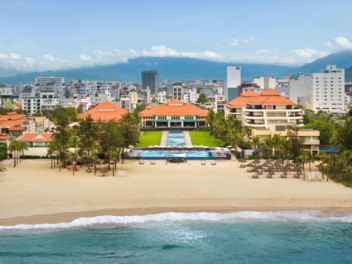an aerial view of a beach with a resort at Pullman Danang Beach Resort in Danang