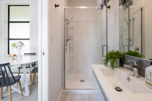 a bathroom with a shower and a sink at The Stables in Newstead