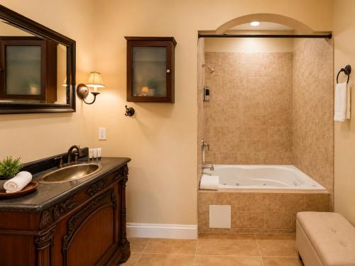 a bathroom with a tub and a sink at 2BR with patio, grill, central AC, enclosed yard in Hollywood