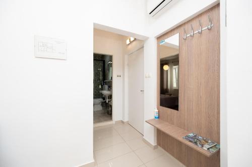 a hallway of a house with a mirror at Apartments and rooms by the sea Jakisnica, Pag - 4160 in Lun