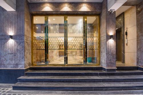 an entrance to a building with a glass door at Kzar Central in Kolkata