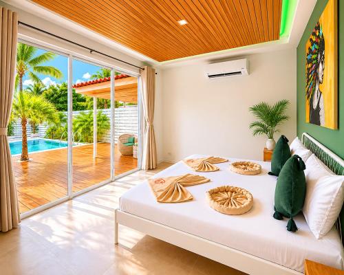 a bedroom with a bed and a large sliding glass door at Oh’lala - 3 BR Pool Villa in Ban Tai