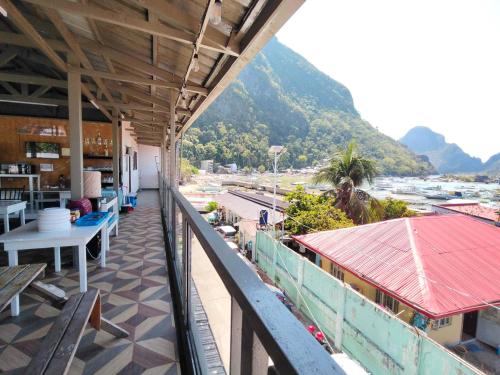 a balcony of a building with a view of the ocean at Joaquinn's Bed and Breakfast El Nido City near Beach in El Nido