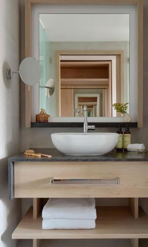 a bathroom with a sink and a mirror at ME by Meliá Barcelona in Barcelona