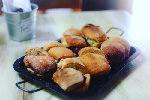 a plate of pastries sitting on a table at Tapas & Surf in Petacaltepe