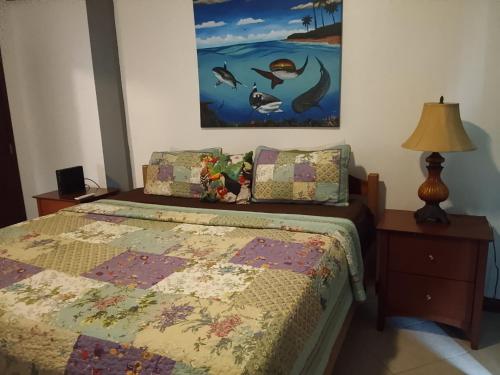 a bedroom with a bed with a quilt on it at Lucky get away in Poughkeepsie