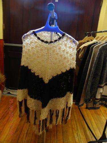 a sweater hanging on a clothes rack in a room at Huaytusive Inn Hotel in Puno