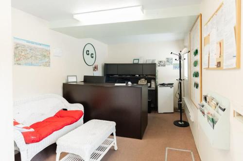 a living room with a couch and a table at Studio Suite 4 Green Gables Resort in Osoyoos