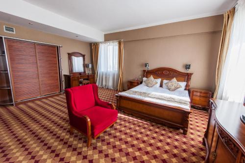 Postel nebo postele na pokoji v ubytování UB City Hotel