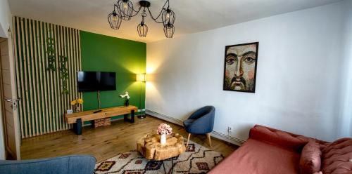 a living room with a couch and a table at Apartament Daria in Târgu Ocna