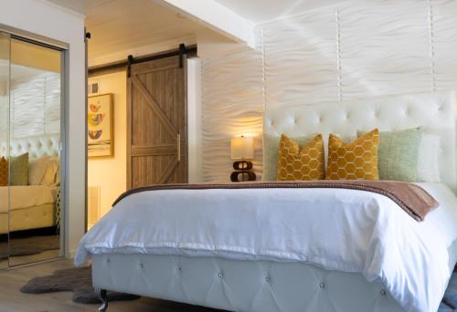 a bedroom with a large bed with a large headboard at Private Luxury Retreat with Kitchen Near SF & Wine Country in San Rafael
