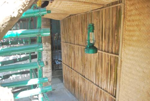 a green light on the wall of a building at Hilltop Lodge in Guwahati