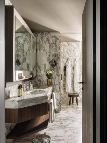 a bathroom with a sink and a shower at ME by Meliá Milan Il Duca in Milan