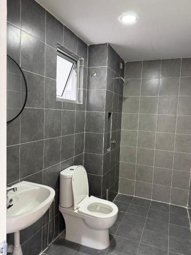 a bathroom with a toilet and a sink at Sufi Islamic Homestay for Islamic only in Nilai
