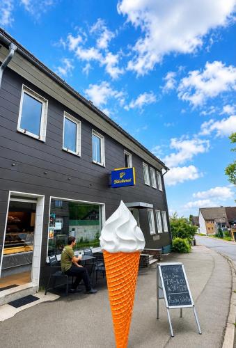 an ice cream cone in front of a store at Mikes Fewo in Hohegeiß
