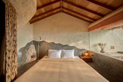 a bedroom with a large bed in a room at Ibala Hotel & Spa in Nha Trang