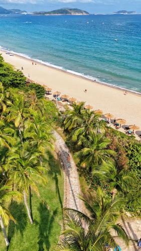 an aerial view of a beach with palm trees at Sheraton Sanya Yalong Bay Resort in Sanya