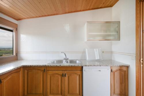 a kitchen with a sink and a window at Ball de Diables in Sant Pau dʼOrdal