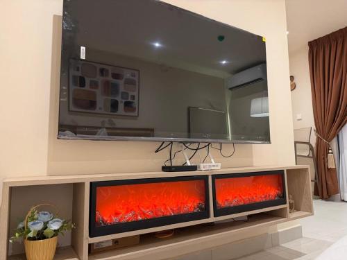 a living room with three fish tanks in front of a mirror at Luxury Aestethics at Bantree in Accra