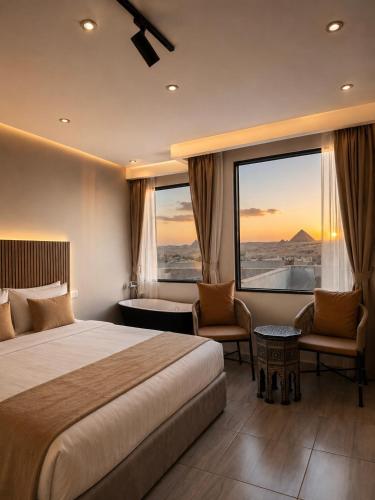 a hotel room with a bed and a large window at King's Gate Pyramids Horizon in Cairo