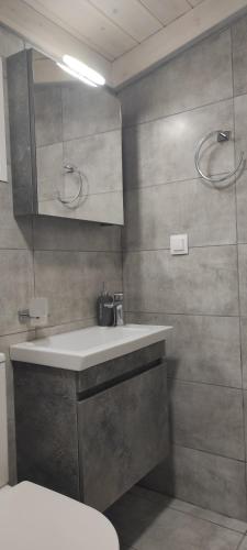 a bathroom with a sink and a toilet at Lea's Studio in Kourouta