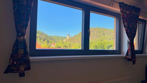 a window with a view of a mountain at Apartment Karlštejn Castle View in Karlštejn