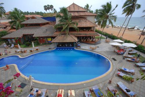 an overhead view of a resort with a large swimming pool at Uday Samudra Leisure Beach Hotel & Spa in Kovalam