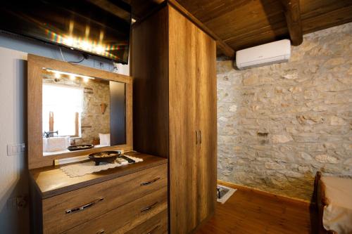 a bathroom with a sink and a mirror at Villa Shuaipaj in Gjirokastër
