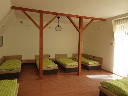 a room with three beds in a room at Ubytování Klicperova in Chlumec nad Cidlinou