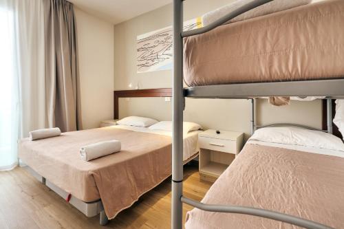 Кровать или кровати в номере Hotel Bettina
