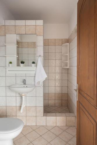 a bathroom with a sink and a shower at Ionion exclusive villa in Syvota
